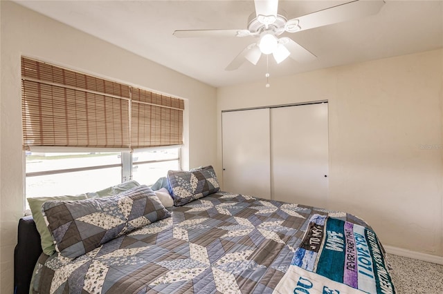 bedroom featuring ceiling fan, a closet, and carpet flooring