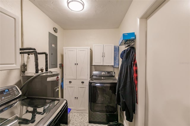 washroom featuring cabinets, washer / clothes dryer, and electric panel