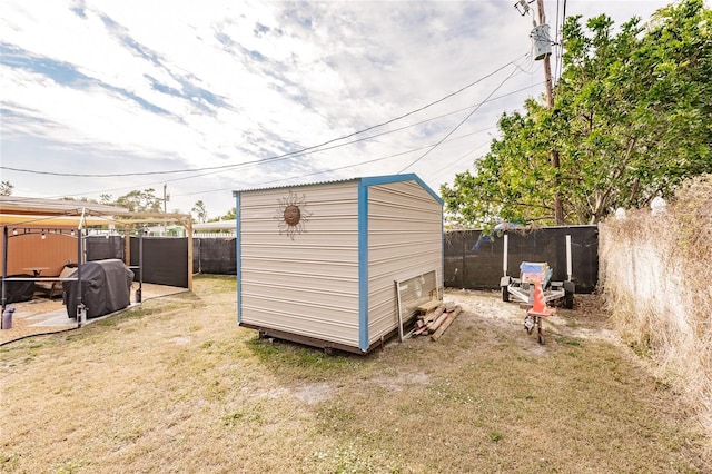 view of outdoor structure with a lawn