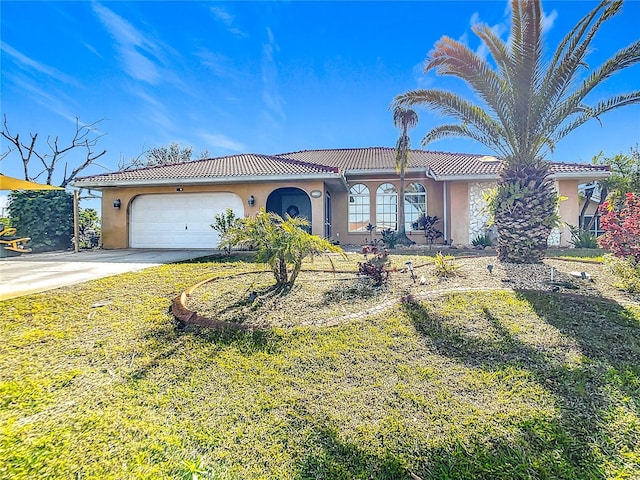 view of front of property featuring a garage and a front lawn