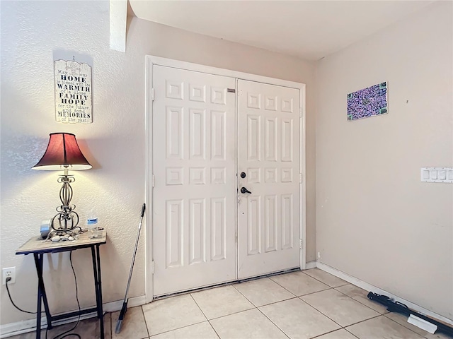 foyer with light tile patterned floors