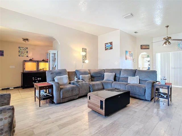 living room with ceiling fan and hardwood / wood-style floors