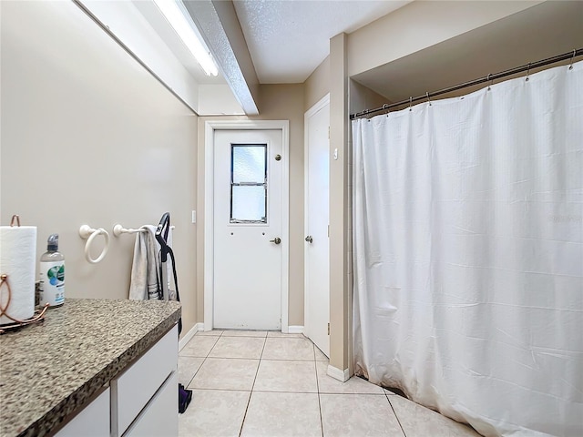 bathroom featuring tile patterned flooring