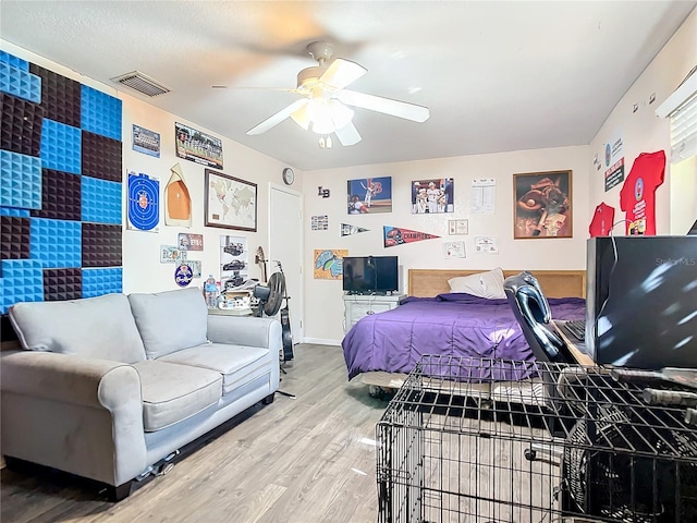 bedroom featuring hardwood / wood-style flooring and ceiling fan