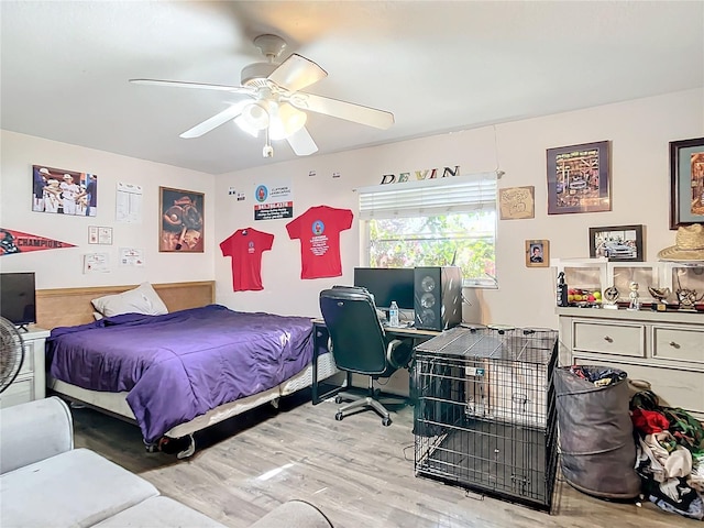 bedroom with ceiling fan and hardwood / wood-style floors