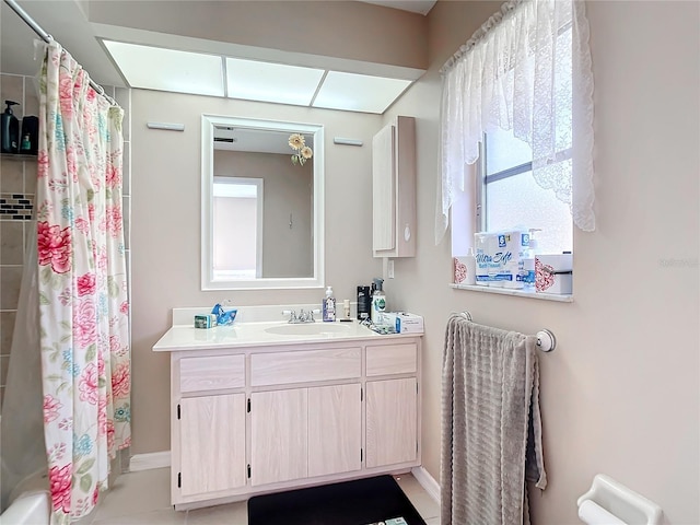 bathroom featuring vanity, tile patterned flooring, and shower / tub combo with curtain