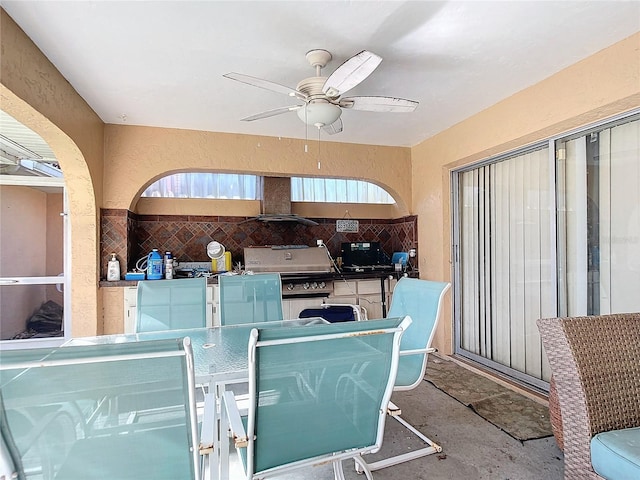 view of patio featuring a grill, area for grilling, and ceiling fan