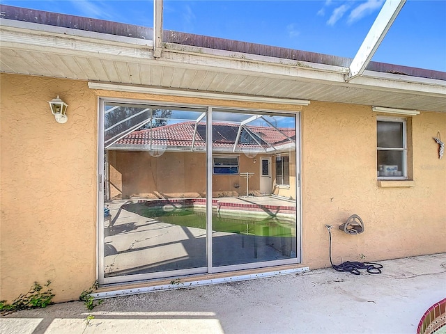 doorway to property featuring a patio