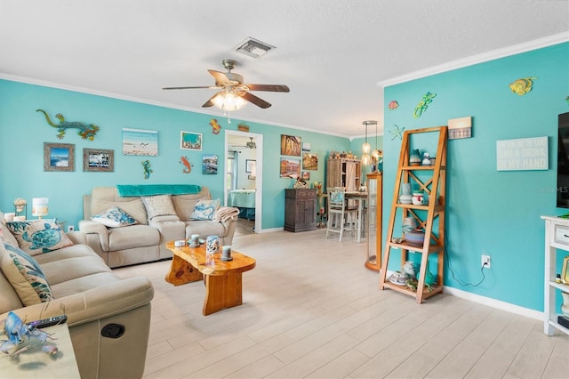 living room featuring ceiling fan, light hardwood / wood-style flooring, and ornamental molding