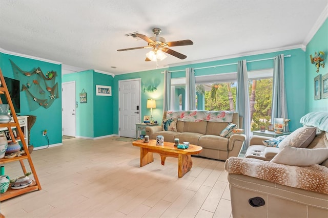 living room featuring ceiling fan, a textured ceiling, ornamental molding, and light hardwood / wood-style floors