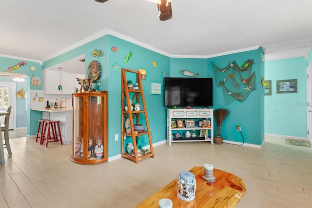 living room featuring crown molding and light hardwood / wood-style floors