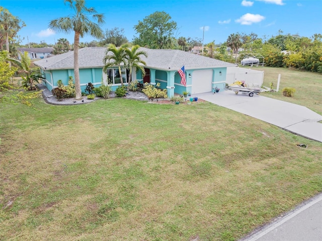 view of front facade with a front lawn and a garage