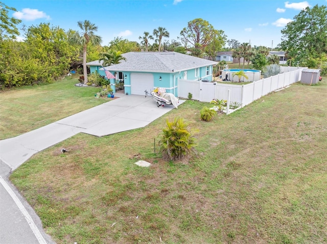 view of front of house featuring a front yard and a garage