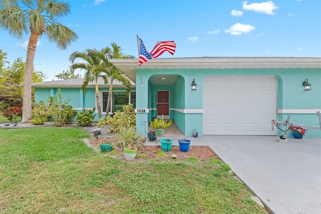 single story home featuring a front yard and a garage