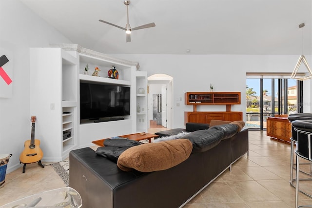 living room featuring ceiling fan, light tile patterned floors, and built in features