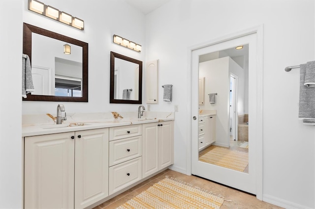 bathroom featuring tile patterned floors and vanity