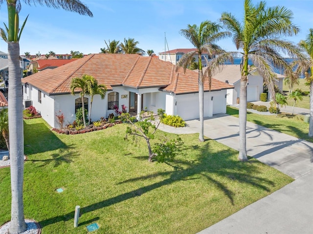 mediterranean / spanish house featuring a front lawn