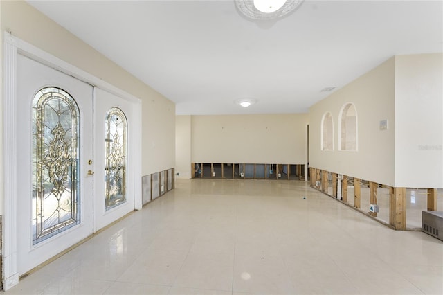 tiled foyer entrance featuring a healthy amount of sunlight