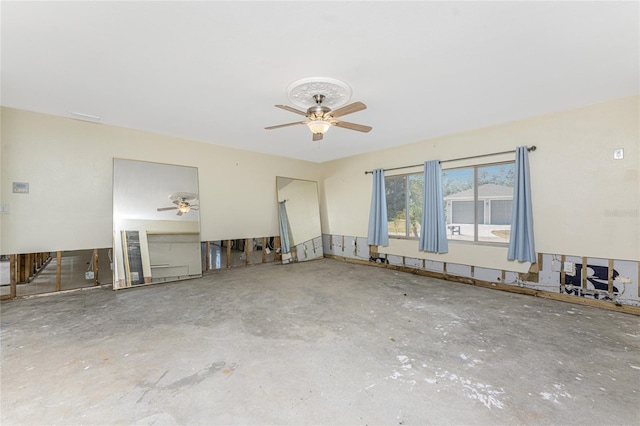 interior space featuring concrete floors and ceiling fan