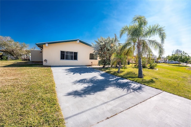 ranch-style house with a front lawn