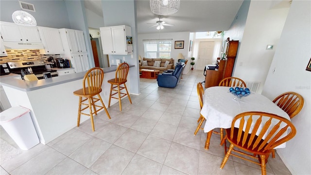 tiled dining room with ceiling fan