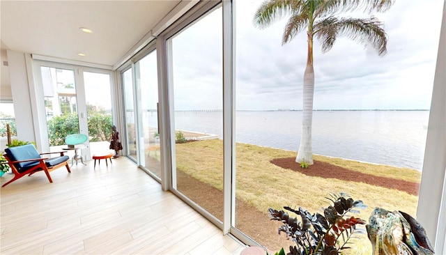 sunroom with a water view