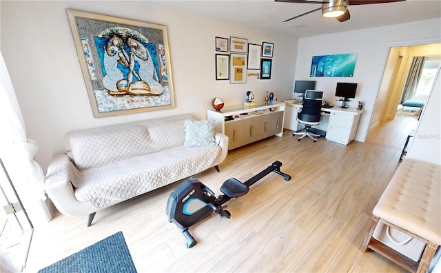 office space featuring ceiling fan and light hardwood / wood-style floors