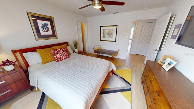 bedroom featuring ceiling fan and light hardwood / wood-style flooring