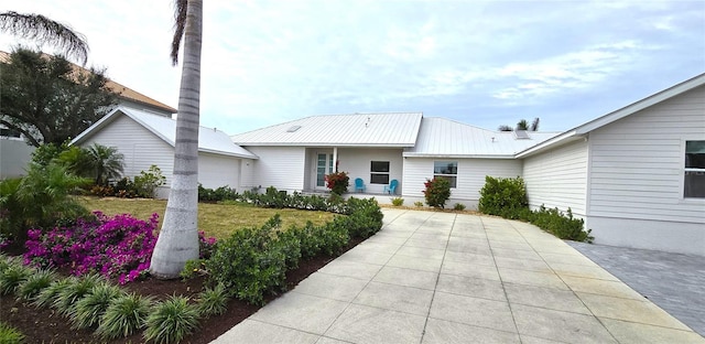 ranch-style house featuring a garage and a front yard