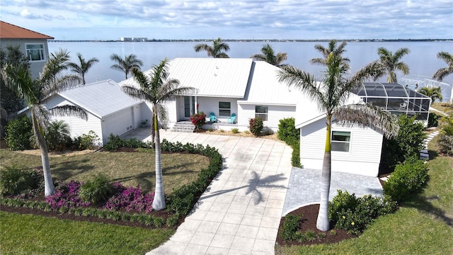 view of front facade featuring a water view and an outdoor structure