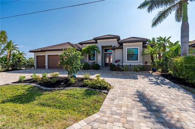 mediterranean / spanish house featuring a garage