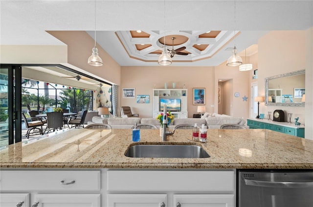 kitchen featuring white cabinetry, coffered ceiling, decorative light fixtures, and dishwasher