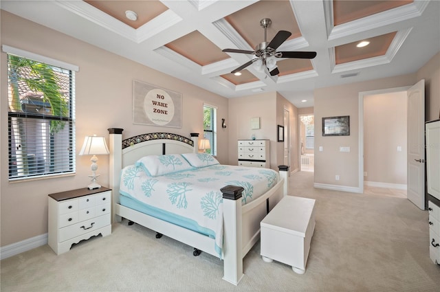 carpeted bedroom with ceiling fan, coffered ceiling, and multiple windows