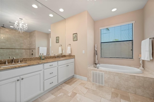 bathroom with a chandelier, plus walk in shower, and vanity