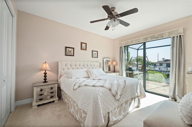 carpeted bedroom with ceiling fan, access to outside, and a closet