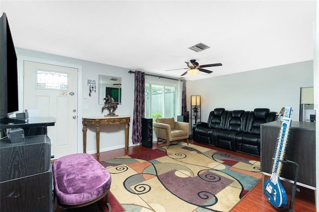 living room with hardwood / wood-style flooring and ceiling fan