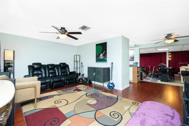 living room featuring dark hardwood / wood-style floors and ceiling fan