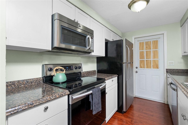 kitchen with white cabinetry, dark hardwood / wood-style flooring, and stainless steel appliances