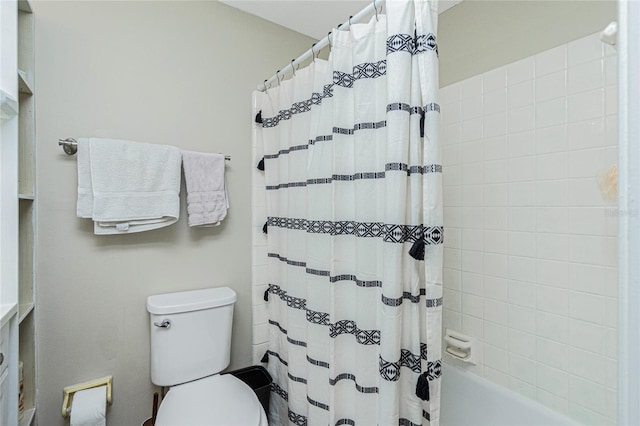 bathroom with shower / bathtub combination with curtain and toilet