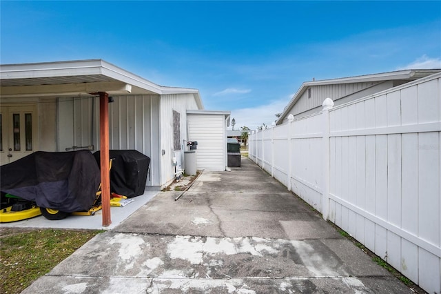 view of side of property with a patio