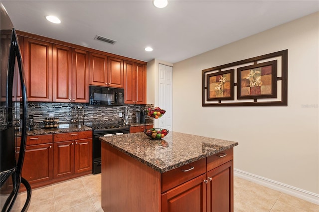 kitchen featuring a kitchen island, visible vents, backsplash, black appliances, and dark stone countertops