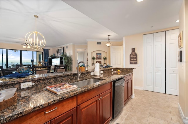 kitchen with black dishwasher, pendant lighting, a sink, and dark stone countertops