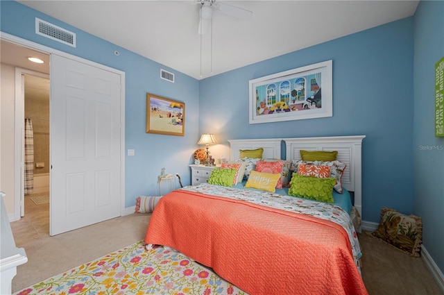 bedroom featuring light colored carpet, visible vents, and baseboards