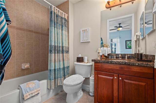 full bathroom featuring ceiling fan, tile patterned flooring, toilet, vanity, and shower / bath combo