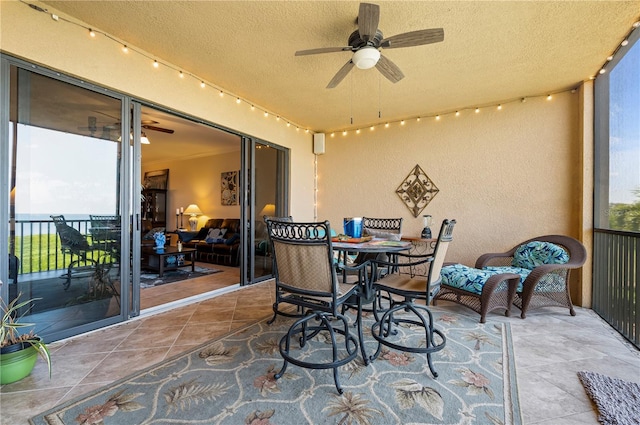 view of patio featuring a ceiling fan and outdoor dining space