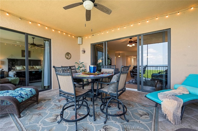 view of patio featuring ceiling fan and outdoor dining area