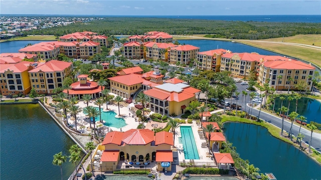 birds eye view of property featuring a water view