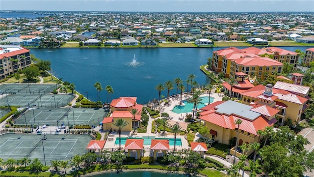 drone / aerial view with a water view and a residential view