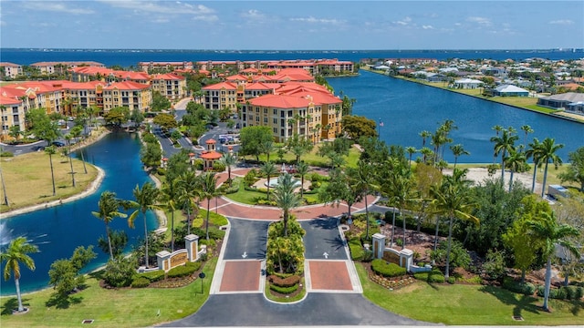 birds eye view of property with a water view