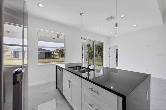 kitchen with sink, white cabinets, a center island with sink, decorative light fixtures, and stainless steel dishwasher